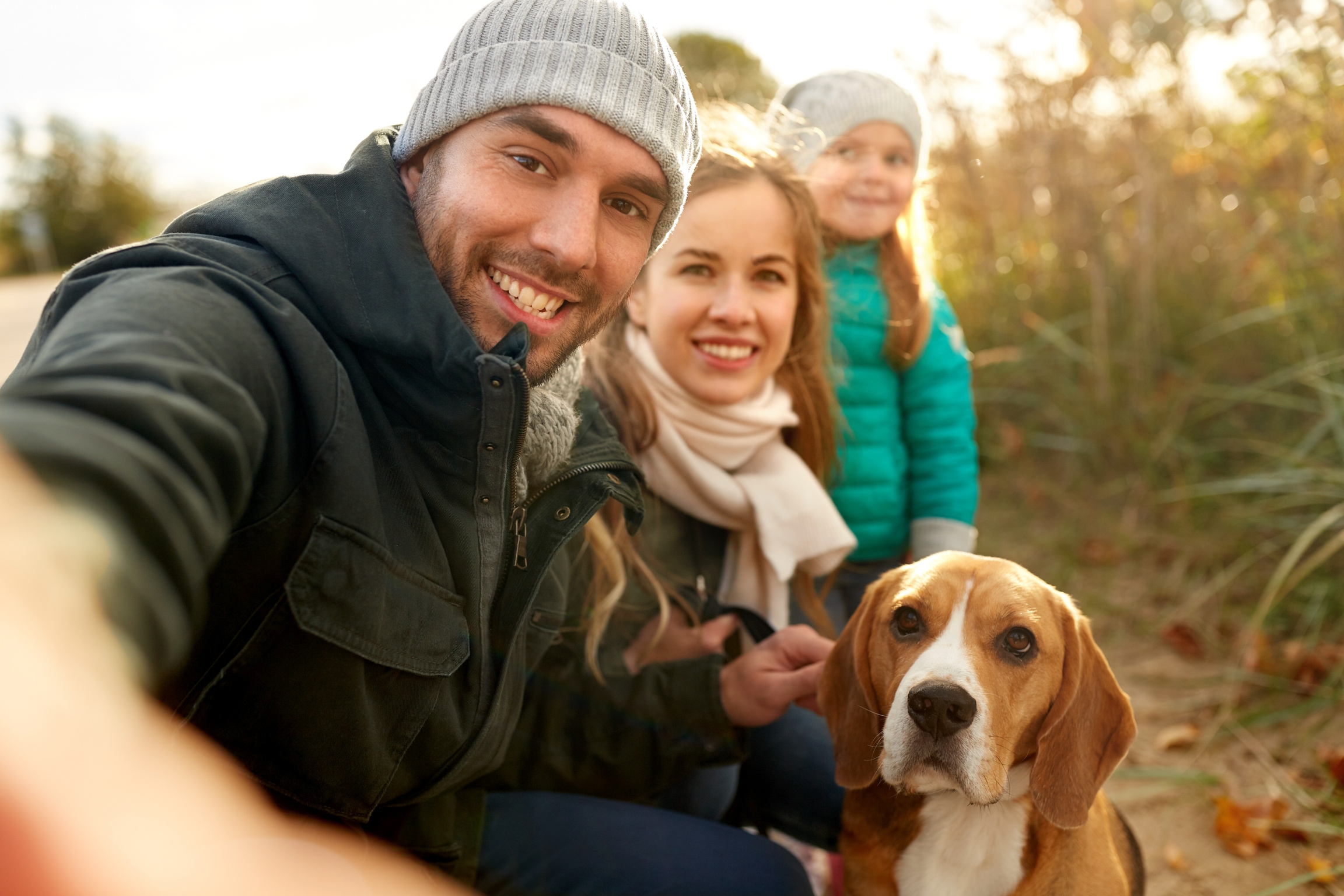 Happy Family with Dog Taking Selfie